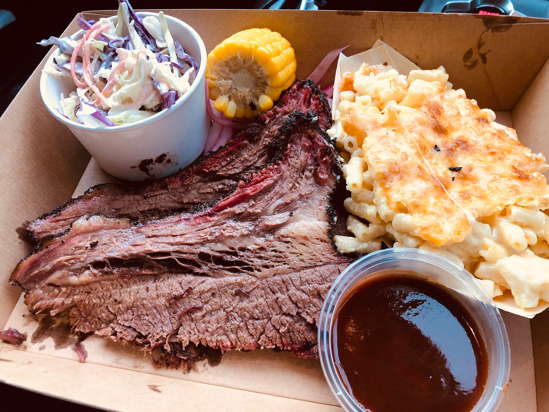 Sliced smoked brisket on a board, photographed in Sydney