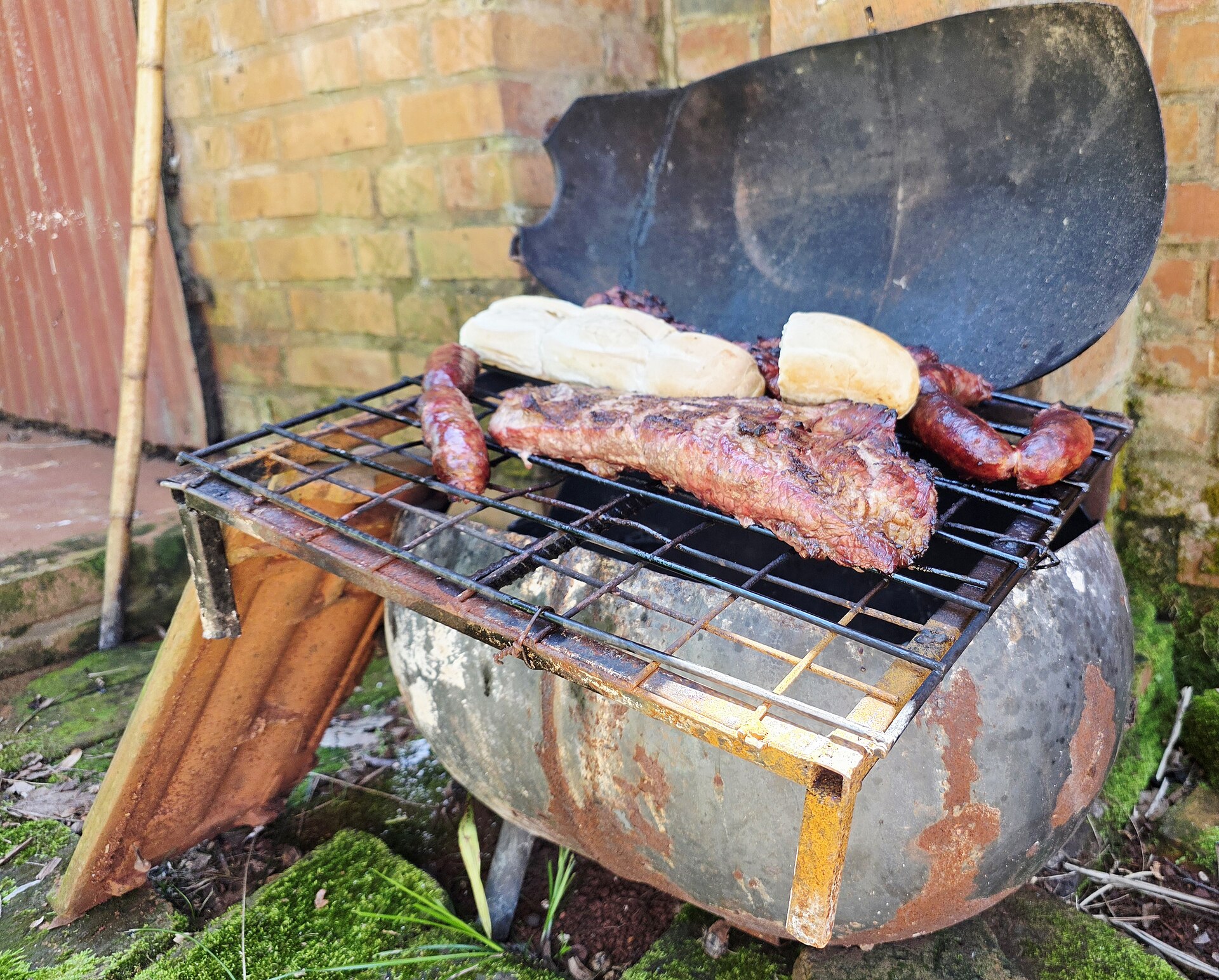 Wood barbecue with beef and sausages
