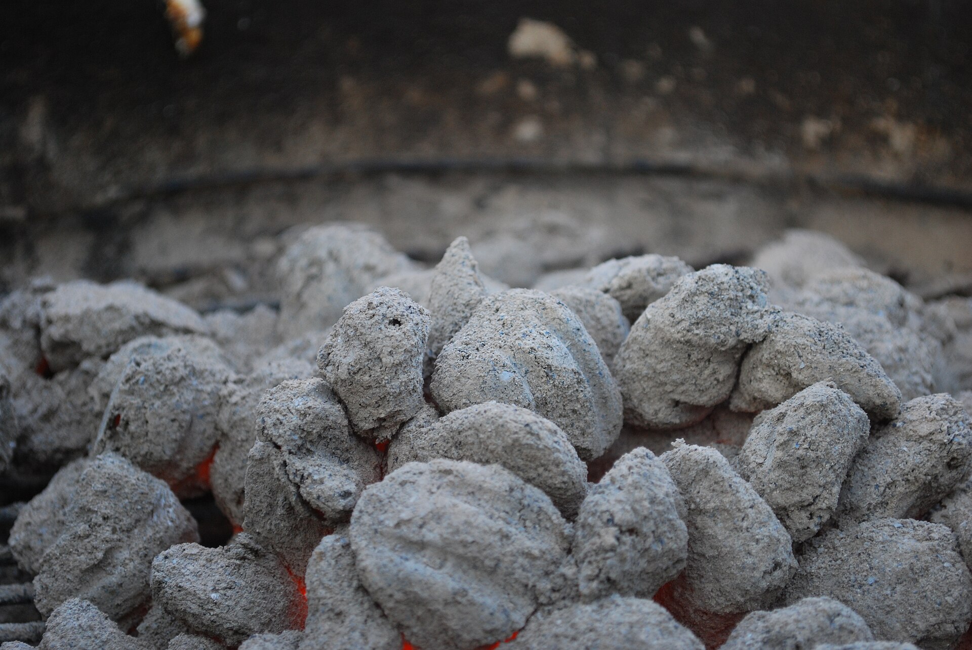 Smouldering charcoal briquettes