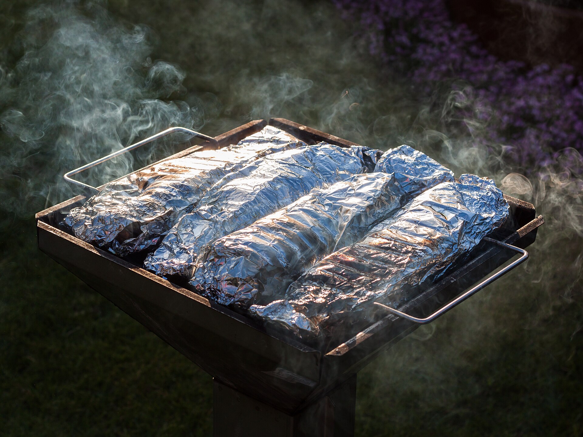 Trout cooking on a grill